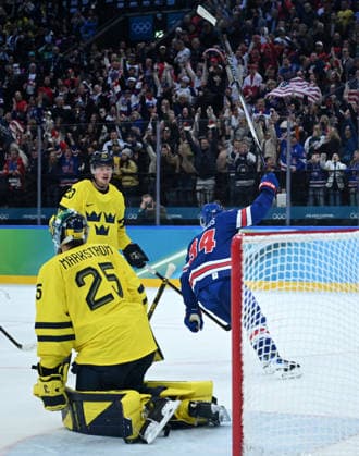 (260219) -- MILAN, Feb. 19, 2026 -- Auston Matthews (R) of the United States celebrates victory after the Ice hockey, Eishockey men s play-offs quarterfinal between Sweden and the United States at the Milan-Cortina 2026 Olympic Winter games, Winterspiele,Spiele, Summer games in Milan, Italy, Feb. 18, 2026. ) (MICO2026)ITALY-MILAN-OLYMPIC WINTER GAMES-ICE HOCKEY-MEN-PLAY-OFFS QUARTERFINALS-SWE VS USA ZhangxHaofu 