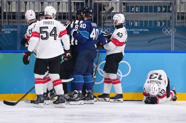 (260219) -- MILAN, Feb. 19, 2026 -- Players of both teams fight as Switzerland s Nico Hischier (1st R) gets injured during the Ice hockey, Eishockey men s play-offs quarterfinal between Finland and Switzerland at the Milan-Cortina 2026 Olympic Winter games, Winterspiele,Spiele, Summer games in Milan, Italy, Feb. 18, 2026. ) (MICO2026)ITALY-MILAN-OLYMPIC WINTER GAMES-ICE HOCKEY-MEN-PLAY-OFFS QUARTERFINALS-FIN VS SUI TaoxXiyi 