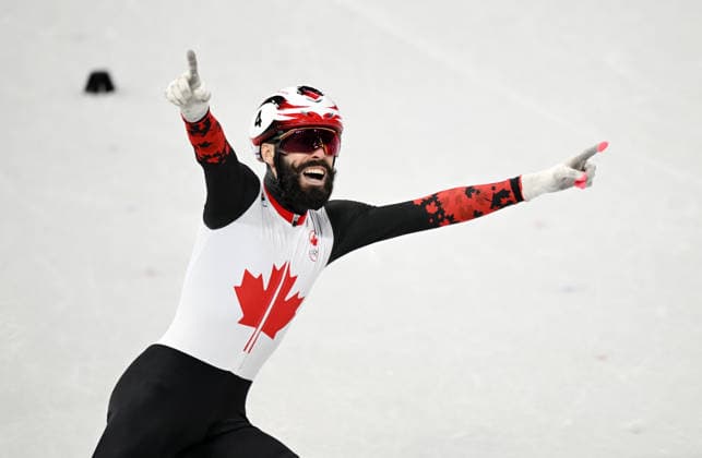 (260219) -- MILAN, Feb. 19, 2026 -- Steven Dubois of Canada celebrates after winning the short track Speed skating, Eisschnelllauf men s 500m final A at the Milan-Cortina 2026 Olympic Winter games, Winterspiele,Spiele, Summer games in Milan, Italy, Feb. 18, 2026. ) (MICO2026)ITALY-MILAN-OLYMPIC WINTER GAMES-SHORT TRACK SPEED SKATING-MEN S 500M-FINALS ChengxMin 
