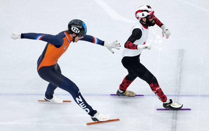 (260219) -- MILAN, Feb. 19, 2026 -- Steven Dubois (R) of Canada crosses the finish line during the short track Speed skating, Eisschnelllauf men s 500m final A at the Milan-Cortina 2026 Olympic Winter games, Winterspiele,Spiele, Summer games in Milan, Italy, Feb. 18, 2026. ) (MICO2026)ITALY-MILAN-OLYMPIC WINTER GAMES-SHORT TRACK SPEED SKATING-MEN S 500M-FINALS XuexYuge 