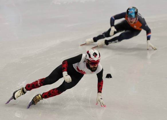 (260219) -- MILAN, Feb. 19, 2026 -- Steven Dubois (L) of Canada and Melle van t Wout of the Netherlands compete during the short track Speed skating, Eisschnelllauf men s 500m final A at the Milan-Cortina 2026 Olympic Winter games, Winterspiele,Spiele, Summer games in Milan, Italy, Feb. 18, 2026. ) (MICO2026)ITALY-MILAN-OLYMPIC WINTER GAMES-SHORT TRACK SPEED SKATING-MEN S 500M-FINALS LaixXiangdong 