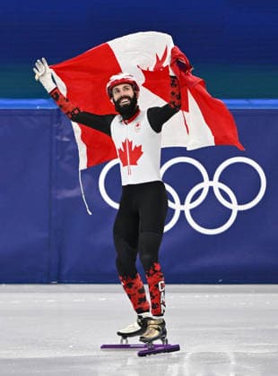 (260219) -- MILAN, Feb. 19, 2026 -- Steven Dubois of Canada celebrates after winning the short track Speed skating, Eisschnelllauf men s 500m final A at the Milan-Cortina 2026 Olympic Winter games, Winterspiele,Spiele, Summer games in Milan, Italy, Feb. 18, 2026. ) (MICO2026)ITALY-MILAN-OLYMPIC WINTER GAMES-SHORT TRACK SPEED SKATING-MEN S 500M-FINALS ChengxMin 