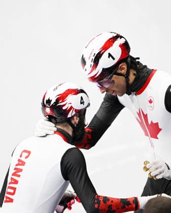 (260219) -- MILAN, Feb. 19, 2026 -- Steven Dubois (L) of Canada celebrates with teammate William Dandjinou after winning the short track Speed skating, Eisschnelllauf men s 500m final A at the Milan-Cortina 2026 Olympic Winter games, Winterspiele,Spiele, Summer games in Milan, Italy, Feb. 18, 2026. ) (MICO2026)ITALY-MILAN-OLYMPIC WINTER GAMES-SHORT TRACK SPEED SKATING-MEN S 500M-FINALS ChengxMin 