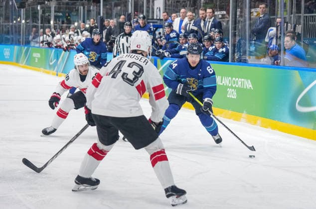 (260219) -- MILAN, Feb. 19, 2026 -- Mikael Granlund (1st R) of Finland vies for the puck during the Ice hockey, Eishockey men s play-offs quarterfinal between Finland and Switzerland at the Milan-Cortina 2026 Olympic Winter games, Winterspiele,Spiele, Summer games in Milan, Italy, Feb. 18, 2026. ) (MICO2026)ITALY-MILAN-OLYMPIC WINTER GAMES-ICE HOCKEY-MEN-PLAY-OFFS QUARTERFINALS-FIN VS SUI SunxFei 