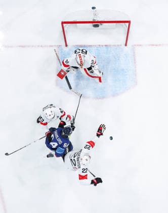 (260219) -- MILAN, Feb. 19, 2026 -- Players of both teams compete during the Ice hockey, Eishockey men s play-offs quarterfinal between Finland and Switzerland at the Milan-Cortina 2026 Olympic Winter games, Winterspiele,Spiele, Summer games in Milan, Italy, Feb. 18, 2026. ) (MICO2026)ITALY-MILAN-OLYMPIC WINTER GAMES-ICE HOCKEY-MEN-PLAY-OFFS QUARTERFINALS-FIN VS SUI SunxFei 