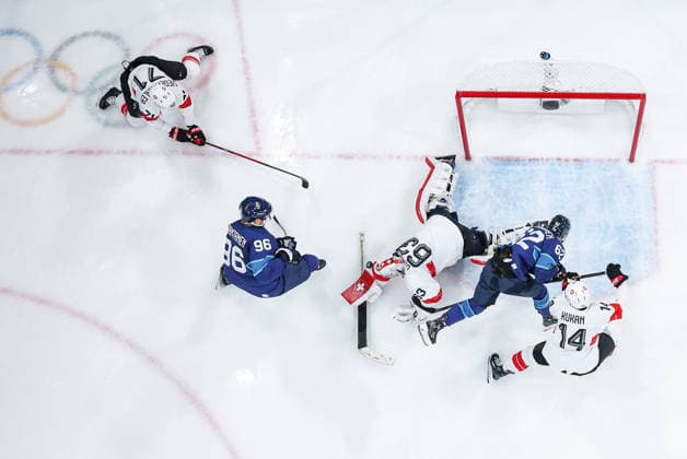 (260219) -- MILAN, Feb. 19, 2026 -- Players of both teams compete during the Ice hockey, Eishockey men s play-offs quarterfinal between Finland and Switzerland at the Milan-Cortina 2026 Olympic Winter games, Winterspiele,Spiele, Summer games in Milan, Italy, Feb. 18, 2026. ) (MICO2026)ITALY-MILAN-OLYMPIC WINTER GAMES-ICE HOCKEY-MEN-PLAY-OFFS QUARTERFINALS-FIN VS SUI SunxFei 