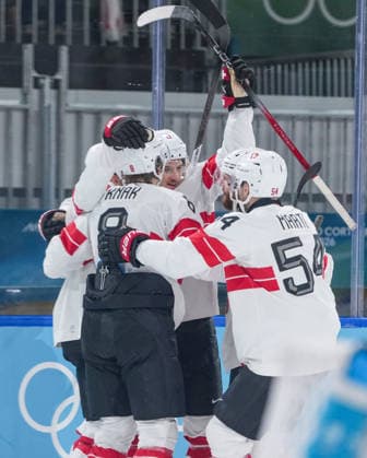 (260219) -- MILAN, Feb. 19, 2026 -- Players of Switzerland celebrate a goal during the Ice hockey, Eishockey men s play-offs quarterfinal between Finland and Switzerland at the Milan-Cortina 2026 Olympic Winter games, Winterspiele,Spiele, Summer games in Milan, Italy, Feb. 18, 2026. ) (MICO2026)ITALY-MILAN-OLYMPIC WINTER GAMES-ICE HOCKEY-MEN-PLAY-OFFS QUARTERFINALS-FIN VS SUI SunxFei 