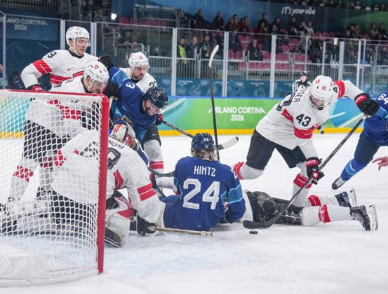 (260219) -- MILAN, Feb. 19, 2026 -- Players of both teams compete during the Ice hockey, Eishockey men s play-offs quarterfinal between Finland and Switzerland at the Milan-Cortina 2026 Olympic Winter games, Winterspiele,Spiele, Summer games in Milan, Italy, Feb. 18, 2026. ) (MICO2026)ITALY-MILAN-OLYMPIC WINTER GAMES-ICE HOCKEY-MEN-PLAY-OFFS QUARTERFINALS-FIN VS SUI SunxFei 