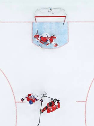 (260219) -- MILAN, Feb. 19, 2026 -- Macklin Celebrini (bottom R) of Canada scores during the Ice hockey, Eishockey men s play-offs quarterfinals match between Canada and the Czech Republic at the Milan-Cortina 2026 Olympic Winter games, Winterspiele,Spiele, Summer games in Milan, Italy, Feb. 18, 2026. ) (MICO2026)ITALY-MILAN-OLYMPIC WINTER GAMES-ICE HOCKEY-MEN-PLAY-OFFS QUARTERFINALS-CAN VS CZE ZhangxHaofu 
