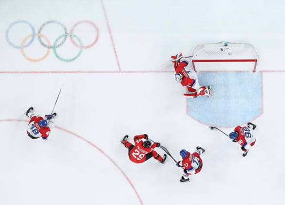(260219) -- MILAN, Feb. 19, 2026 -- Players of both teams vie for the puck during the Ice hockey, Eishockey men s play-offs quarterfinals match between Canada and the Czech Republic at the Milan-Cortina 2026 Olympic Winter games, Winterspiele,Spiele, Summer games in Milan, Italy, Feb. 18, 2026. ) (MICO2026)ITALY-MILAN-OLYMPIC WINTER GAMES-ICE HOCKEY-MEN-PLAY-OFFS QUARTERFINALS-CAN VS CZE ZhangxHaofu 