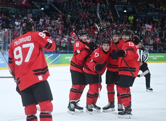 (260219) -- MILAN, Feb. 19, 2026 -- Players of Canada celebrate scoring during the Ice hockey, Eishockey men s play-offs quarterfinals match between Canada and the Czech Republic at the Milan-Cortina 2026 Olympic Winter games, Winterspiele,Spiele, Summer games in Milan, Italy, Feb. 18, 2026. ) (MICO2026)ITALY-MILAN-OLYMPIC WINTER GAMES-ICE HOCKEY-MEN-PLAY-OFFS QUARTERFINALS-CAN VS CZE ZhangxHaofu 