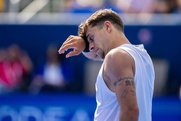 2026 Delray Beach Open - Day 3 - Flavio Cobolli (ITA) Vs Terence Atmane (FRA) Flavio Cobolli of Italy dries his face against Terence Atmane of France during their match on Day 3 of the Delray Beach Open at the Delray Tennis Center in Delray Beach, Florida, on February 18, 2026. Delray Beach FL United States  Copyright: xMauricioxPaizx originalFilename:paiz-2026delr260218_npdeb.jpg