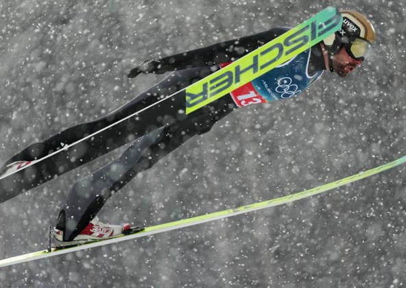 (260219) -- PREDAZZO, Feb. 19, 2026 -- Johannes Rydzek of Germany competes during the Ski jumping, Skispringen, Ski, nordisch competition round of the nordic combined team sprint at the 2026 Milan-Cortina Winter Olympics in Predazzo, Italy, Feb. 19, 2026. ) (MICO2026)ITALY-PREDAZZO-OLYMPIC Winter games, Winterspiele,Spiele, Summer games NORDIC COMBINED-TEAM SPRINT MengxYongmin 