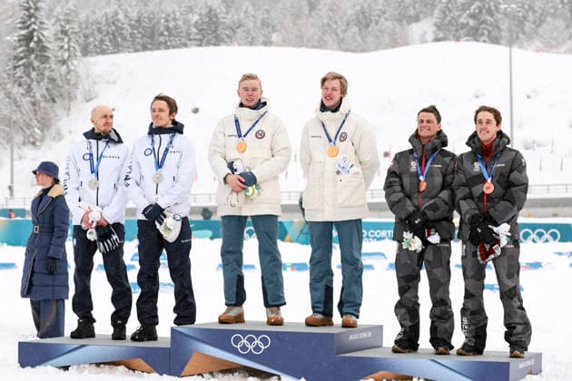 OLYMPICS - Winter Olympic Games, Olympische Spiele, Olympia, OS Milano Cortina 2026 TESERO,ITALY,19.FEB.26 - OLYMPICS, NORDIC SKIING, NORDIC COMBINED - Winter Olympic Games Milano Cortina 2026, team sprint, medal ceremony. Image shows the rejoicing of Ilkka Herola, Eero Hirvonen (FIN), Andreas Skoglund, Jens Luraas Oftebro (NOR), Johannes Lamparter and Stefan Rettenegger (AUT). Keywords: medal, mascot.  GEPAxpictures xMatthiasxTrinkl