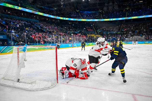 MILAN, ITALY 20260219 Sweden s Hilda Svensson in a close fight with Shannon Sigrist, Switzerland, in front of goalie Andrea Brändli during the women s bronze medal match in Ice hockey, Eishockey between Switzerland and Sweden at the Santagiulia Arena during the Milan Olympics. *** The image is included in the SPORTS PACKAGE. For others PAYMENT IMAGE *** MILANO ITALY x10070x *** MILAN, ITALY 20260219 Sweden s Hilda Svensson in a close fight with Shannon Sigrist, Switzerland, in front of goalie Andrea Brändli during the women s bronze medal match in ice hockey between Switzerland and Sweden at the Santagiulia Arena during the Milan Olympics The image is included in the SPORTS PACKAGE For others PAYMENT IMAGE MILANO ITALY x10070x  Copyright: xJessicaxGow TTx 2026 OLYMPICS ICE HOCKEY SWITZERLAND-SWEDEN BRONZE MATCH
