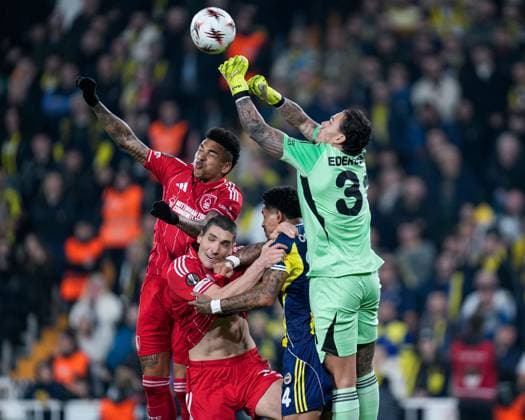 Ederson of Fenerbahce punches the ball over Nikola Milenkovic of Nottingham Forest Football Club and Igor Jesus of Nottingham Forest Football Club Fenerbache v Nottingham Forest, UEFA Europa League, Knockout Round Play Offs, First Leg, Football, Sukru Saracoglu Stadium, Istanbul, Turkiye - 19 Feb 2026Istanbul Sukru Saracoglu Stadium Turkey EDITORIAL USE ONLY No use with unauthorised audio, video, data, fixture lists, club league logos or live services. Online in-match use limited to 120 images, no video emulation. No use in betting, games or single club league player publications. Copyright: xRaddadxJebarah Shutterstockx 16674269ar