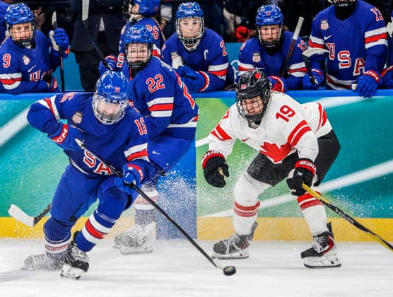 United States Tessa Janecke (22) watches as United States Hayley Scamurra (16) moves the puck away from Canada s Brianne Jenner (19) in the second period of the Women s Hockey Gold Medal Game between Canada and the USA at the Milano Santagiulia Ice hockey, Eishockey Arena in Milan, Italy, on Thursday, February 19, 2026.  OLY20260219317 AARONxJOSEFCZYK