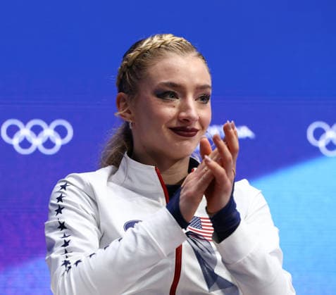 February 19, 2026, Milan, Lombardy, Italy: AMBER GLENN sits in the leader s position seat after skating her Women s Single Skating free program in the Figure skating, Eiskunstlauf at the Milano Cortina 2026 Winter Olympic Games, Olympische Spiele, Olympia, OS Olympics 2026: Milano Cortina: Figure Skating Women Single Skating  - ZUMAc179 20260219_oly_c179_132 Copyright: xMickaelxChavetx