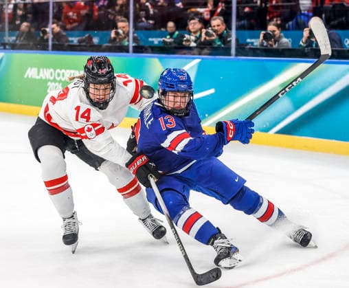 United States Grace Zumwinkle (13) and Canada s Renata Fast (14) go for the puck in the third period of the Gold Medal Game between Canada and the USA at the Milano Santagiulia Ice hockey, Eishockey Arena in Milan, Italy, on Thursday, February 19, 2026.  OLY20260219329 AARONxJOSEFCZYK