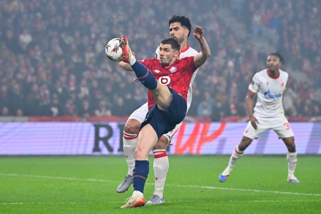 FOOTBALL : Lille vs Etoile Rouge Belgrade - Europa League - Lille - 19 02 2026 Rodrigao ( 5 - Red Star Belgrade ) and Romain Perraud ( 15 - Lille ) during the UEFA Europa League match between Lille OSC and Red Star Belgrade at Stade Pierre Mauroy on February 19, 2026 in Lille, France. ( Photo by Federico Pestellini PsnewZ ) - LilleFrance  Copyright: xFedericoxPestellinix