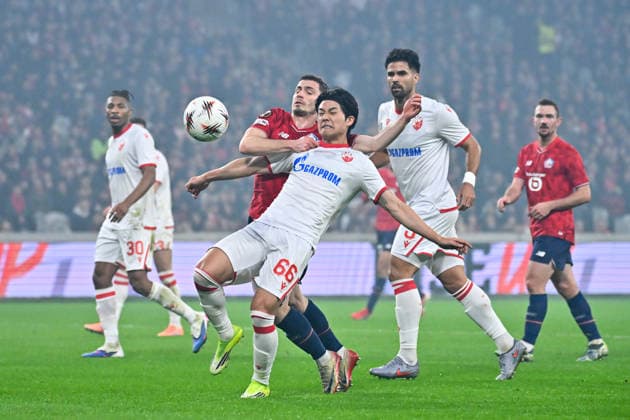 FOOTBALL : Lille vs Etoile Rouge Belgrade - Europa League - Lille - 19 02 2026 Youngwoo Seol ( 66 - Red Star Belgrade ) and Romain Perraud ( 15 - Lille ) during the UEFA Europa League match between Lille OSC and Red Star Belgrade at Stade Pierre Mauroy on February 19, 2026 in Lille, France. ( Photo by Federico Pestellini PsnewZ ) - LilleFrance  Copyright: xFedericoxPestellinix