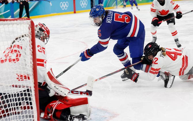 United States Megan Keller (5) scores the winning goal next to Canada s Claire Thompson (42) in sudden death three on three overtime of the Gold Medal Game between Canada and the USA at the Milano Santagiulia Ice hockey, Eishockey Arena in Milan, Italy, on Thursday, February 19, 2026. The USA won the game 2-1 to win the gold medal. Canada wins the Silver and Switzerland won the Bronze medal.  OLY20260218386 AARONxJOSEFCZYK