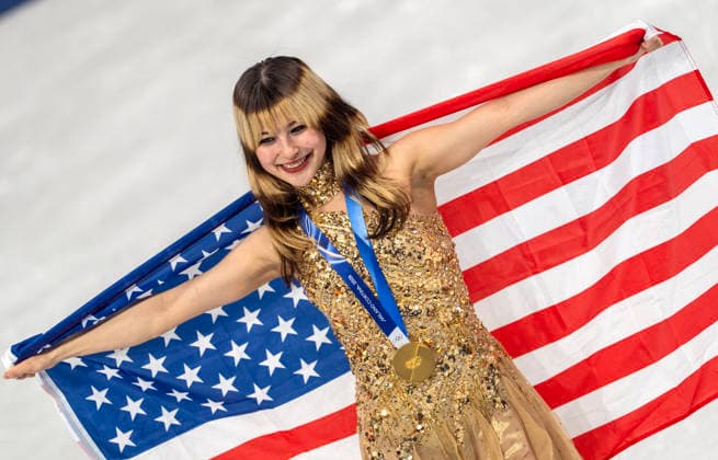February 19, 2026, Milan, Lombardy, Italy: American ALYSA LIU and her gold medal and flag after the Women Single Skating- Free Skating medal round Thursday night at this Milano Cortina 2026 Olympics. Olympics 2026: Milano Cortina: Figure skating, Eiskunstlauf Women s  - ZUMAa35_ 20260219_oly_a35_025 Copyright: xDanielxA.xAndersonx