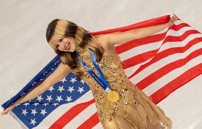 February 19, 2026, Milan, Lombardy, Italy: American ALYSA LIU and her gold medal and flag after the Women Single Skating- Free Skating medal round Thursday night at this Milano Cortina 2026 Olympics. Olympics 2026: Milano Cortina: Figure skating, Eiskunstlauf Women s  - ZUMAa35_ 20260219_oly_a35_026 Copyright: xDanielxA.xAndersonx