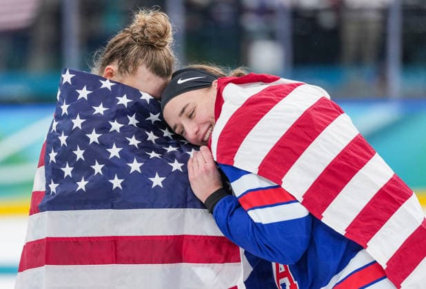 (260220) -- MILAN, Feb. 20, 2026 -- Hayley Scamurra (R) of the United States celebrates with teammate after the awarding ceremony for the Ice hockey, Eishockey women s gold medal game between the United States and Canada at the Milan-Cortina 2026 Olympic Winter games, Winterspiele,Spiele, Summer games in Milan, Italy, Feb. 19, 2026. ) (MICO2026)ITALY-MILAN-OLYMPIC WINTER GAMES-ICE HOCKEY-WOMEN-GOLD MEDAL GAME-USA VS CAN SunxFei 