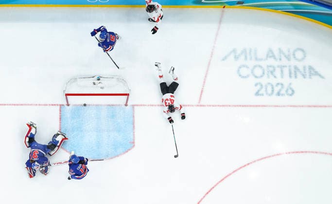 (260220) -- MILAN, Feb. 20, 2026 -- Kristin O neill (1st R) of Canada falls down after scoring during the Ice hockey, Eishockey women s gold medal game between the United States and Canada at the Milan-Cortina 2026 Olympic Winter games, Winterspiele,Spiele, Summer games in Milan, Italy, Feb. 19, 2026. ) (MICO2026)ITALY-MILAN-OLYMPIC WINTER GAMES-ICE HOCKEY-WOMEN-GOLD MEDAL GAME-USA VS CAN SunxFei 
