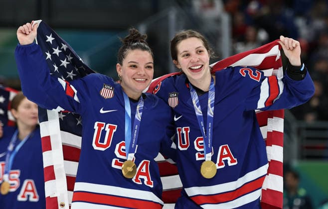 (260220) -- MILAN, Feb. 20, 2026 -- Cayla Barnes (L) and Hannah Bilka of the United States celebrate with their gold medals after the awarding ceremony for the Ice hockey, Eishockey women s gold medal game between the United States and Canada at the Milan-Cortina 2026 Olympic Winter games, Winterspiele,Spiele, Summer games in Milan, Italy, Feb. 19, 2026. ) (MICO2026)ITALY-MILAN-OLYMPIC WINTER GAMES-ICE HOCKEY-WOMEN-GOLD MEDAL GAME-USA VS CAN WangxKaiyan 