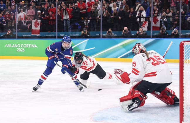 (260220) -- MILAN, Feb. 20, 2026 -- Megan Keller (L) of the United States scores the winning goal against Canada during the Ice hockey, Eishockey women s gold medal game between the United States and Canada at the Milan-Cortina 2026 Olympic Winter games, Winterspiele,Spiele, Summer games in Milan, Italy, Feb. 19, 2026. ) (MICO2026)ITALY-MILAN-OLYMPIC WINTER GAMES-ICE HOCKEY-WOMEN-GOLD MEDAL GAME-USA VS CAN WangxKaiyan 
