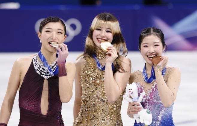 Milan Cortina Olympics: Figure skating, Eiskunstlauf (From L) Silver medalist Kaori Sakamoto of Japan, gold medalist Alysa Liu of the United States and bronze medalist Ami Nakai of Japan pose on the podium during the medal ceremony for the women s figure skating event at the Milan Cortina Olympics at Milano Ice Skating Arena in Milan on Feb. 19, 2026.  A14AA0005306550P