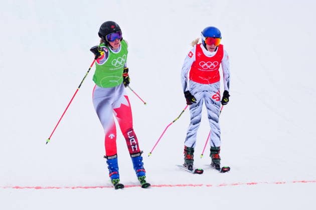 February 20, 2026, Livigno, Italy: Canada s Hannah Schmidt, left, pumps her fist as she crosses the finish line ahead of Switzerland s Fanny Smith during the women s ski cross 1 8 finals at the Milano Cortina 2026 Winter Olympic Games, Olympische Spiele, Olympia, OS in Livigno, Italy, Friday, Feb. 20, 2026. Canada News - February 20, 2026  - ZUMAc35_ 20260220_zaf_c35_004 Copyright: xSeanxKilpatrickx