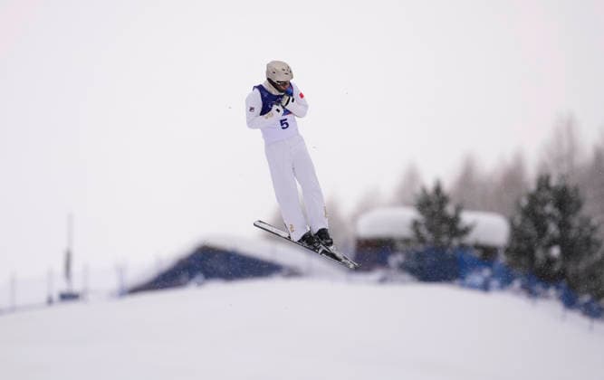 (260220) -- LIVIGNO, Feb. 20, 2026 -- Wang Xindi of China competes during the freestyle skiing men s aerials qualification 1 at the Milan-Cortina 2026 Olympic Winter games, Winterspiele,Spiele, Summer games in Livigno, Italy, Feb. 20, 2026. ) (MICO2026)ITALY-LIVIGNO-OLYMPIC WINTER GAMES-FREESTYLE SKIING-MEN S AERIALS-QUALIFICATION HuxChao 