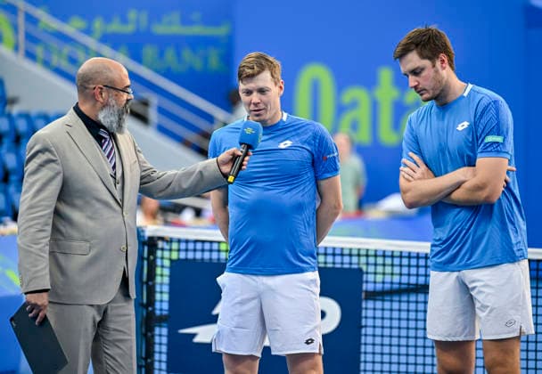ATP, Tennis Herren Qatar ExxonMobil Open-Doubles Final Harri Heliovaara of Finland and Henry Patten of Great Britain speak during an on-court interview after winning the menÕs doubles final against Julian Cash and Lloyd Glasspool of Great Britain at the ATP men s Qatar ExxonMobil Open 2026 tennis tournament at the Khalifa International Tennis Complex in Doha, Qatar, on February 20, 2026. DOHA Qatar Copyright: xNOUSHADx