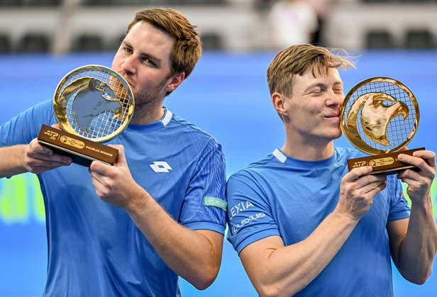 ATP, Tennis Herren Qatar ExxonMobil Open-Doubles Final Harri Heliovaara of Finland and Henry Patten of Great Britain pose with their trophies after winning their menÕs Doubles Final match against Julian Cash and Lloyd Glasspool of Great Britain during the ATP Qatar ExxonMobil Open 2026 tennis tournament at the Khalifa International Tennis Complex in Doha, Qatar, on February 20, 2026. DOHA Qatar Copyright: xNOUSHADx