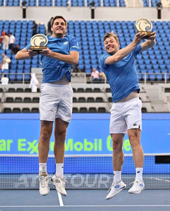 ATP, Tennis Herren Qatar ExxonMobil Open-Doubles Final Harri Heliovaara of Finland and Henry Patten of Great Britain pose with their trophies after winning their menÕs Doubles Final match against Julian Cash and Lloyd Glasspool of Great Britain during the ATP Qatar ExxonMobil Open 2026 tennis tournament at the Khalifa International Tennis Complex in Doha, Qatar, on February 20, 2026. DOHA Qatar Copyright: xNOUSHADx