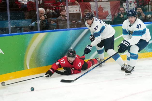 February 20, 2026, Milan, ITALY: Finland defenceman Miro Heiskanen (41), Canada forward Macklin Celebrini (17) and Finland defenceman Niko Mikkola (77) vie for control of the puck during first period Men s Olympic semifinal Ice hockey, Eishockey action at the 2026 Milan Cortina Winter Olympics in Milan, Friday, Feb. 20, 2026. Canada News - February 20, 2026  - ZUMAc35_ 20260220_zaf_c35_039 Copyright: xNathanxDenettex