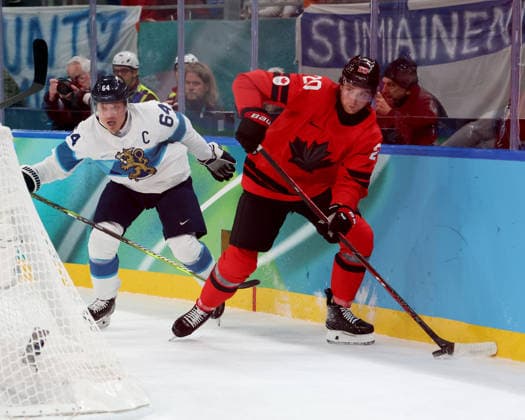 February 20, 2026, Milan, Lombardy, Italy: Thomas Harley (20) of Team Canada and Mikael Granlund (64) of Team Finland in a men s Ice hockey, Eishockey semifinal during the Milano Cortina 2026 Olympic Winter games, Winterspiele,Spiele, Summer games at Milano Santagiulia Ice Hockey Arena Olympics 2026: Milano Cortina: Ice Hockey-Men Semifinal- CAN-FIN  - ZUMAm117 20260220_oly_m117_011 Copyright: xDavidxMcIntyrex