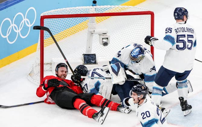 ITALY, MILAN - FEBRUARY 20, 2026: Canada s Sam Bennett, Finland s Niko Mikkola, goaltender Juuse Saros, Rasmus Ristolainen (L-R back) and Sebastian Aho (front) in a menâ€™s Ice hockey, Eishockey play-off semifinal match at the Milano Santagiulia Ice Hockey Arena, as part of the 2026 Winter Olympic Games, Olympische Spiele, Olympia, OS Peter Kovalev TASS  89001161