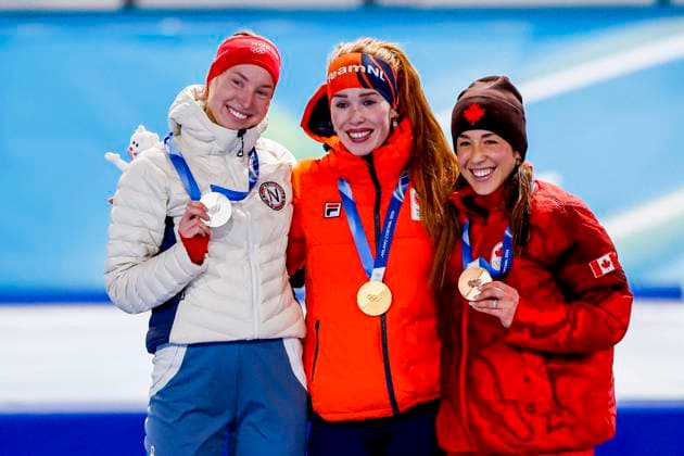 second Ragne Wiklund of Norway and winner Antoinette Rijpma-De Jong of the Netherlands and third Valerie Maltais of Canada smiling during the medal ceremony after Women s 1500m, Milano Cortina 2026 Winter Olympics: Day 14, Speed skating, Eisschnelllauf - Milano Cortina 2026 Winter Olympics: Day 14, Milano Speed Skating Stadium, February 20, 2026, Milan, Italy.