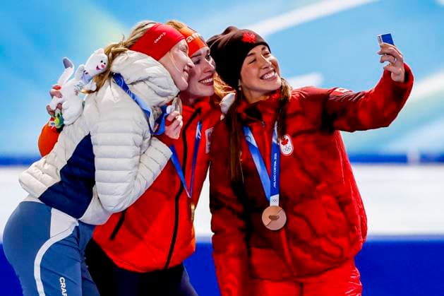second Ragne Wiklund of Norway and winner Antoinette Rijpma-De Jong of the Netherlands and third Valerie Maltais of Canada smiling during the medal ceremony after Women s 1500m, Milano Cortina 2026 Winter Olympics: Day 14, Speed skating, Eisschnelllauf - Milano Cortina 2026 Winter Olympics: Day 14, Milano Speed Skating Stadium, February 20, 2026, Milan, Italy.