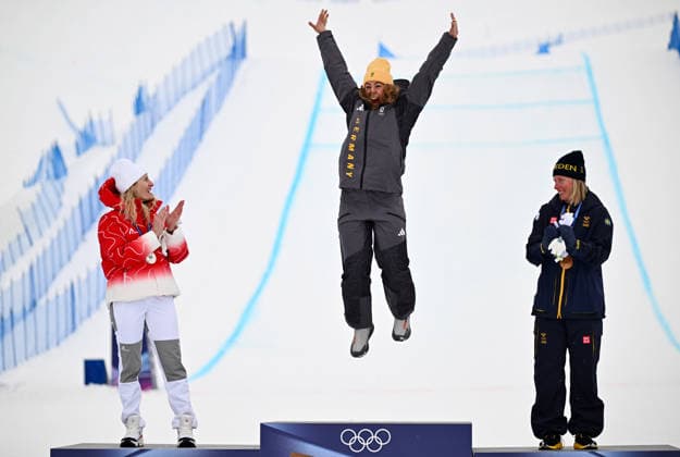 (260220) -- LIVIGNO, Feb. 20, 2026 -- Gold medalist Daniela Maier (C) of Germany celebrates during the awarding ceremony of the freestyle skiing women s ski cross event at the Milan-Cortina 2026 Olympic Winter games, Winterspiele,Spiele, Summer games in Livigno, Italy, Feb. 20, 2026. ) (MICO2026)ITALY-LIVIGNO-OLYMPIC WINTER GAMES-FREESTYLE SKIING-WOMEN S SKI CROSS ZhangxHongxiang 