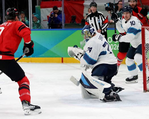 February 20, 2026, Milan, Lombardy, Italy: Juuse Saros (74) of Team Finland stops a shot against Team Canada in a men s Ice hockey, Eishockey semifinal during the Milano Cortina 2026 Olympic Winter games, Winterspiele,Spiele, Summer games at Milano Santagiulia Ice Hockey Arena Milan Italy - ZUMAm117 20260220_oly_m117_013 Copyright: xDavidxMcIntyrex