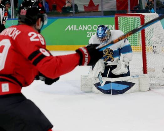 February 20, 2026, Milan, Lombardy, Italy: Juuse Saros (74) of Team Finland stops shot by Nathan MacKinnon (29) of Team Canada in a men s Ice hockey, Eishockey semifinal during the Milano Cortina 2026 Olympic Winter games, Winterspiele,Spiele, Summer games at Milano Santagiulia Ice Hockey Arena Olympics 2026: Milano Cortina: Ice Hockey-Men Semifinal- CAN-FIN  - ZUMAm117 20260220_oly_m117_019 Copyright: xDavidxMcIntyrex