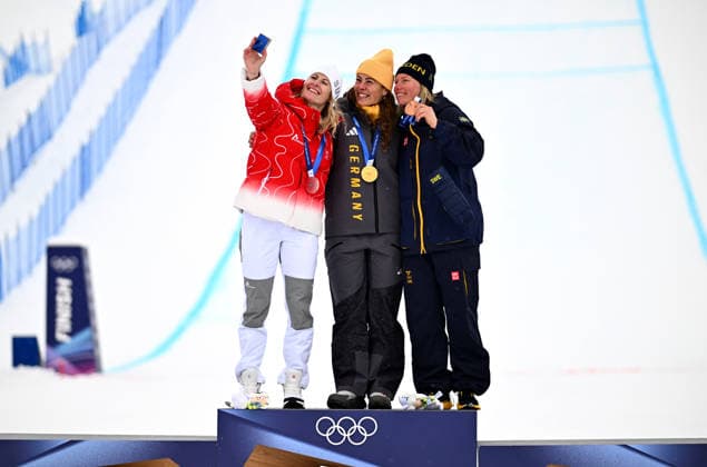(260220) -- LIVIGNO, Feb. 20, 2026 -- Gold medalist Daniela Maier (C) of Germany, silver medalist Fanny Smith (L) of Switzerland, and bronze medalist Sandra Naeslund of Sweden take a selfie during the awarding ceremony of the freestyle skiing women s ski cross event at the Milan-Cortina 2026 Olympic Winter games, Winterspiele,Spiele, Summer games in Livigno, Italy, Feb. 20, 2026. ) (MICO2026)ITALY-LIVIGNO-OLYMPIC WINTER GAMES-FREESTYLE SKIING-WOMEN S SKI CROSS ZhangxHongxiang 