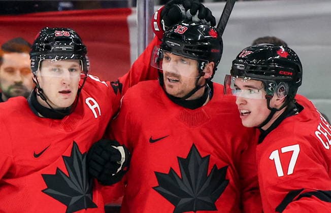 ITALY, MILAN - FEBRUARY 20, 2026: Canada s Nathan MacKinnon, Sam Reinhart and Macklin Celebrini (L-R) celebrate a goal in a menâ€™s Ice hockey, Eishockey play-off semifinal match at the Milano Santagiulia Ice Hockey Arena, as part of the 2026 Winter Olympic Games, Olympische Spiele, Olympia, OS Peter Kovalev TASS  89004365