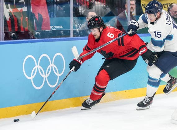 ITALY, MILAN - FEBRUARY 20, 2026: Canada s Travis Sanheim (L) and Finland s Anton Lundell fight for the puck in a menâ€™s Ice hockey, Eishockey play-off semifinal match at the Milano Santagiulia Ice Hockey Arena, as part of the 2026 Winter Olympic Games, Olympische Spiele, Olympia, OS Peter Kovalev TASS  89004511