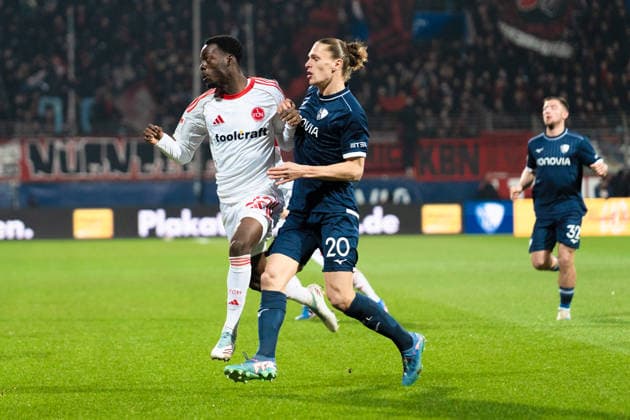 Deutschland: 2. Bundesliga 2025 2026 23. Spieltag, VfL Bochum vs. 1. FC Nürnberg Freitag, 20.02.2026 Vonovia Ruhr Stadion, Nordrhein-Westfalen Luka Lochoshvili (1. FC Nürnberg, 24) Noah Loosli (VfL Bochum, 20)